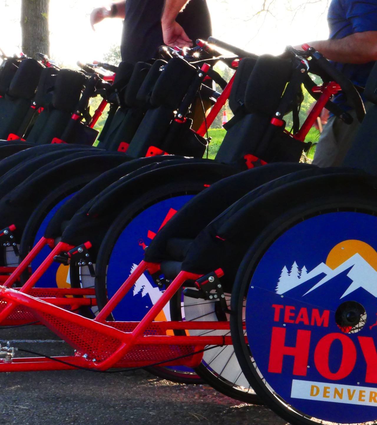 A row of Team Hoyt Denver racing chairs lined up before a race